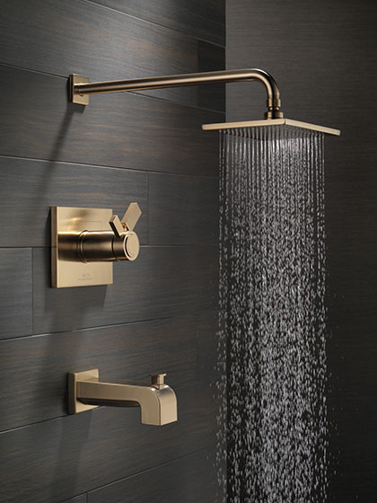 Delta Vero Collection Champagne Bronze Tub and Shower Combination Faucet with Water On