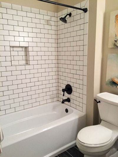 Oil Rubbed Bronze Tub and Shower Faucet with Bronze Shower Curtain Rod Tank Lever and White Subway Tiles