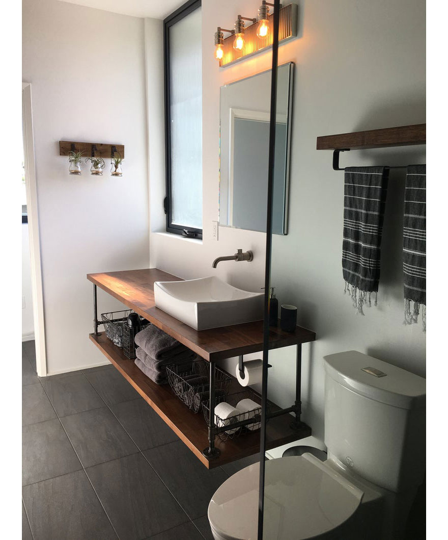 Floating Bathroom Vanity with Industrial Piping and Wall Mount Sink Faucet